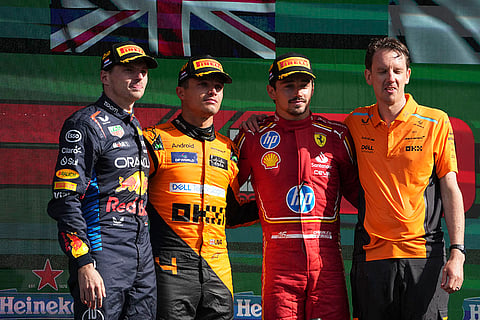 Dutch Grand Prix 2024: Winner McLaren driver Lando Norris of Britain, centre left, celebrates on the podium with second placed Red Bull driver Max Verstappen of the Netherlands, left, third Ferrari driver Charles Leclerc of Monaco, centre right and Norris' race engineer 